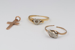 An 18ct yellow gold ring, size L 1/2, 2.1 grams, a 9ct yellow gold ring (cut) and a 9ct cross pendant, 2.2 grams 