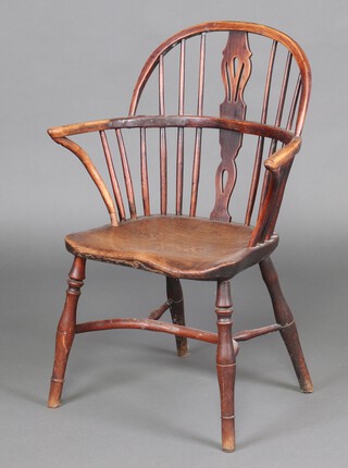 A 19th Century elm and yew rail back carver chair with pierced vase shaped slat back, raised on turned supports with crinoline stretcher 89cm h x 49cm w x 38cm d  