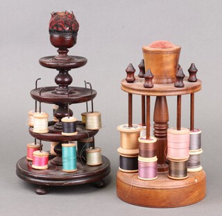 A Victorian circular 3 tier graduated cotton reel/bobbin stand, the top with pin cushion 29cm x 17cm together with a 20th Century circular 2 tier ditto 26cm x 14cm 
