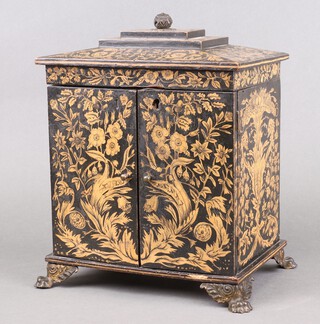 A 19th Century lacquered and painted pine jewellery box with floral and oak leaf painted decoration, the hinged lid fitted a tray above 2 short and 2 long drawers enclosed by panelled doors 29cm h x 25cm w x 17cm d 
