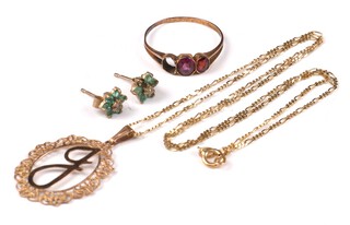 A 9ct yellow gold ring size K, a 9ct pendant and chain 40cm and a pair of ear studs, 2.9 grams 