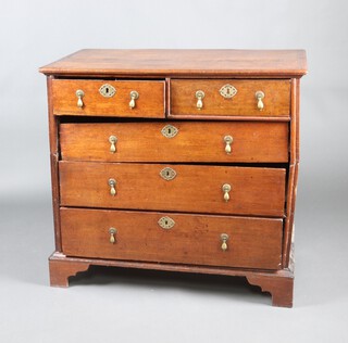 An 18th Century oak, pine lined, chest of 2 short and 3 long drawers with brass pear drop handles, raised on bracket feet 94cm h x 101cm w x 56cm d 