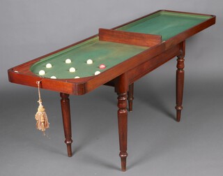 A Victorian mahogany table top bar billiard table, raised on turned supports  88cm h x 106cm x 58cm w (when closed) complete with 9 turned billiard balls 