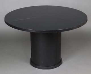 Skovby Mobelfabrik, a circular black extending dining table.