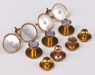 Three 9ct yellow gold studs and 4 mother of pearl mounted ditto, gross weight 7.5 grams and 4 gilt others 