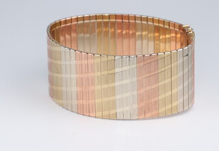A 9ct 3 colour gold bracelet, 19.5cm long x 3cm wide, 40.1 grams 