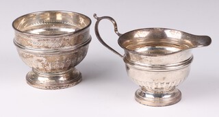 An Art Deco demi-fluted silver cream jug and sugar bowl, Sheffield 1934, 230 grams 