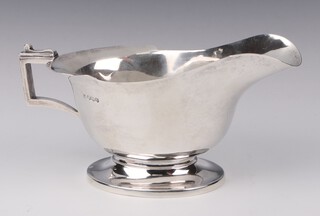 A silver Art Deco sauce boat with angular handles, Sheffield 1937, 21cm, 302 grams 
