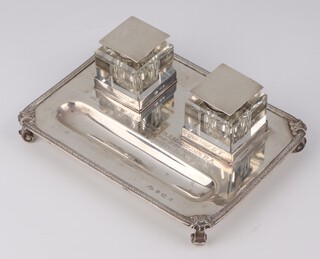 A rectangular silver ink stand with inscription " Presented to Colonel B.A.H. Goldie. R.A. as a token of respect from the W.Os, N.C.Os and men of The 344th  Battery R.A. and 2 silver mounted inkwells, Birmingham 1929, maker Adie Brothers 18cm, weighable silver 332 grams 