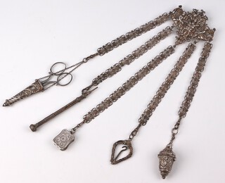 A Victorian silver chatelaine with mask and cherub clip, with chain supporting a pair of scissors, propelling pencil, thimble case, corkscrew, vesta and scissors, London 1889, gross weight 116 grams 