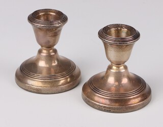A pair of silver dwarf candlesticks Birmingham 1964, 6cm