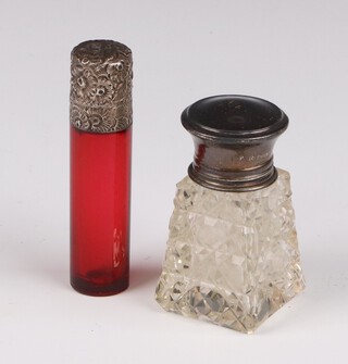 A Victorian silver ruby glass circular scent with stopper 7cm, a clear glass ditto 
