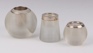 A circular silver match striker Birmingham 1924, 6.5cm (cracked), a smaller ditto 4.5cm and a tapered ditto 5.5cm 