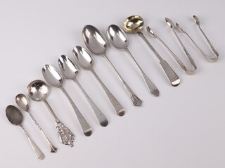 A George III silver mustard spoon with engraved monogram London 1807, 8 other spoons and 2 pairs of sugar nips, 142 grams 