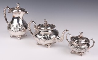 An Edwardian repousse silver plated 3 piece tea set with bird finials, scroll and floral decoration and ivory resistors, on scroll feet, Ivory Exemption Certificate47JP19EJ
