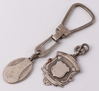 A silver key ring and sports fob 19 grams 