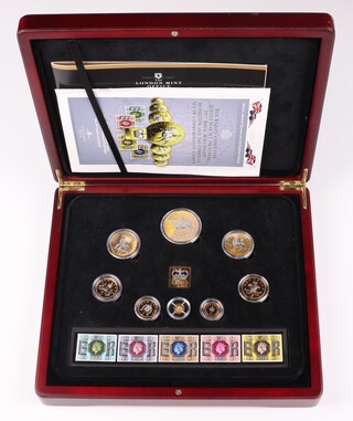 An Elizabeth II 585 standard commemorative coin, proof, 0.5 grams, together with a London Mint 1977 Silver Jubilee Majesty Year set, no.163 of 483, cased, with certificate 