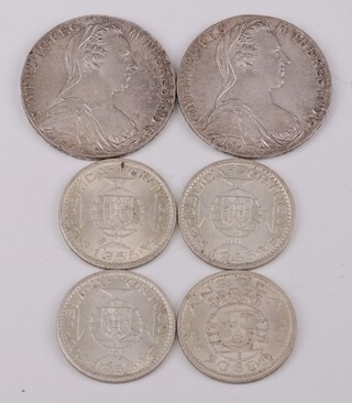 Two Maria Theresa 1780 restrikes and 4 Portuguese 20 dollar coins, 96 grams 