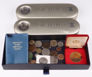 Two Royal Mint 2000 Time Capsules, a 1935 crown and other world coins 