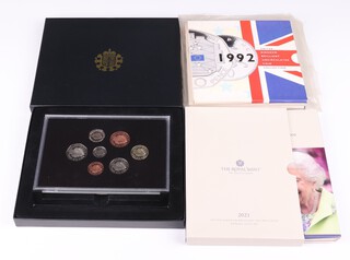 Four United Kingdom brilliant uncirculated coin sets 1990, 1991 (x2) and 1992, together with a 2021 United Kingdom brilliant uncirculated set and a 2008 ditto 