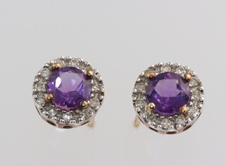 A pair of 9ct yellow gold amethyst and diamond ear studs, the amethysts 0.5ct each, the diamonds in total 0.05ct, 8mm, 1.4 grams