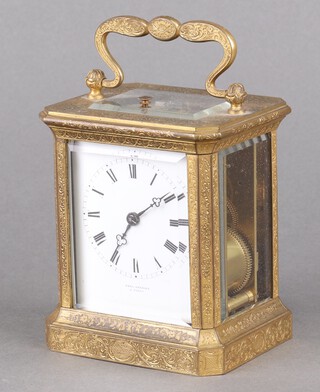 Paul Garnier of Paris, a French 19th Century 8 day striking carriage clock with 6 cm enamelled dial, Roman numerals marked Paul Garnier A'Paris, contained in a gilt metal case, back plated signed Paul Garnier Paris, striking on a bell, case numbered in 3 places 3392, complete with key 10cm x 9cm x 7cm 