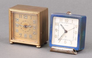 LeCoultre, an Art Deco alarm clock, the 5cm silvered dial with Arabic numerals, the dial marked 2  and Swiss,   contained in a gilt metal case 6cm x 5.5cm x 3.5cm (currently running) together with a Swiss travelling clock with gilt dial and Arabic numerals in a gilt metal case, the back marked DF8O (not running, has 2 replacement back feet)  6cm x 6cm x 3cm 
