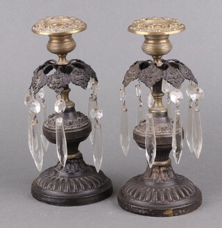 A pair of 19th Century bronze and gilt metal lustres, hung cut glass drops on circular bases, 20cm h x 9cm diam. 