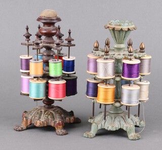 A Victorian Rococo style 2 tier green painted pierced metal cotton reel/bobbin stand 22cm, together with a Victorian gilt metal and rosewood 2 tier bobbin stand, the top fitted a pin cushion 22cm 