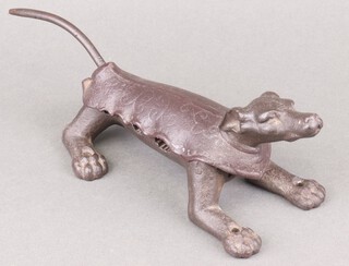 A Victorian iron cork press in the form of a dog 26cm 