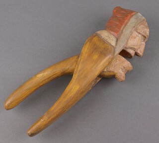 A Continental carved and painted wooden nut cracker in the form of an old lady 25cm 