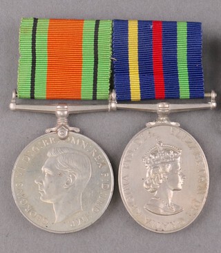 A pair of medals comprising Defence medal and Civil Defence Long Service Good Conduct medal, unnamed as issue, mounted for wear 