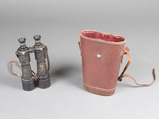 Carl Zeiss, a pair of early 20th Century Jena, Dodekar 12 x 50 binoculars numbered 1045211, with adjustable lens shields and pull out lens hoods, contained in original leather carrying case 