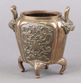 A 19th Century Japanese oval twin handled vase, the body cast dragons and flowers and with lion mask twin handles 12cm 