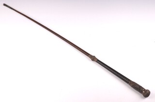 A riding whip, the embossed handle decorated a fox hunting scene 92cm 
