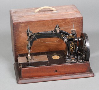 A 19th Century, circa 1870's, Wheeler and Wilson American manual sewing machine, model no.8, in wooden carrying case 