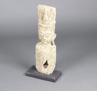 A carved Eastern hardwood bust, raised on an ebonised base 64cm x 29cm