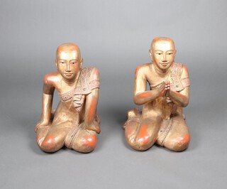 Two carved Burmese hardwood and gilt painted figures of kneeling monks 53cm h x 45cm w x 33cm d 