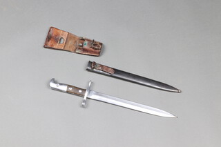 A Swiss M1918 bayonet, the cross bar numbered 669653, blade marked Elsener Schwyz, complete with scabbard and leather frog 