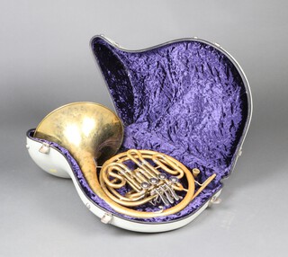 A Paxman student model brass French horn with mouth piece (keys are stiff) 