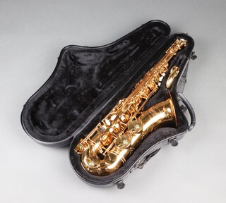 A Unison Custom 2000 brass saxophone, cased 