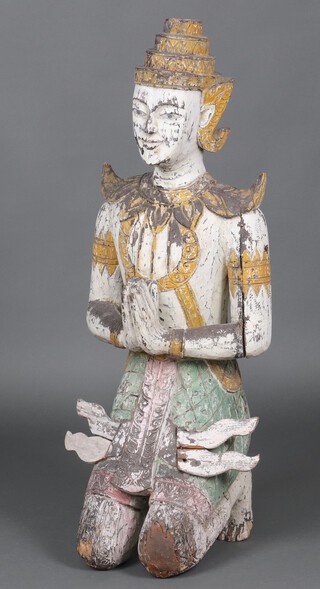 An Eastern carved wooden and painted figure of a seated deity in prayer 98cm h x 23cm 