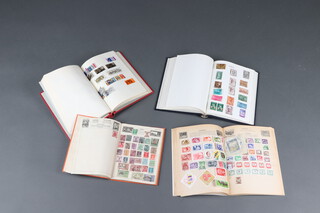 A red Adelphi album of mint and used GB stamps Victoria to Elizabeth II, an Improved stamp album of mint and used world stamps including GB, India, Holland and Japan, a Venture album of world stamps and a blue album of world stamps - South Africa, Italy, France 
