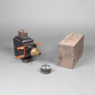 A 19th Century magic lantern, contained in a black metal case, with lens, converted to electricity together with a pressed metal carrying case 