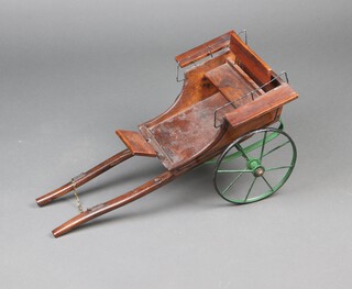 A scratch built wooden cart with iron wheels and suspension 29cm x 63cm x 32cm 