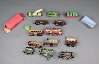 A Wells, pressed metal National Savings British Toys Are Best, clock work model omnibus (dented), an LNER and Southern O gauge clockwork tank engine (both a/f), an O gauge barrel wagon with Castrol barrels boxed and various items of O gauge rolling stock including a Southern railways crane 