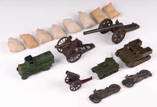 A selection of Britains Toys and John Hill and Co. lead models to include 2 field guns, 1 Howitzer, 2 Johillco pressed motorbikes, a Dinky tank, a Charbens truck, a Britains Carden Loyd tank (with 2 figures) and a collection of 8 sandbags 