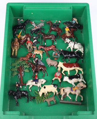 A collection of Britains and other figures to include farm animals, mounted cavalry, hunting figures on horses, cow boys, Indians and scenery 