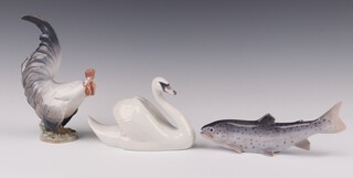 A Royal Copenhagen figure of a cockerel 1025 20cm, ditto swan 955 17cm and a trout 2676 20cm