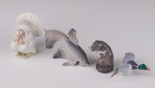 A Royal Copenhagen figure of an otter eating a fish 2333 7cm, an angel fish 3067 7cm, duck 6cm and a turkey 4784 8cm (chipped) 